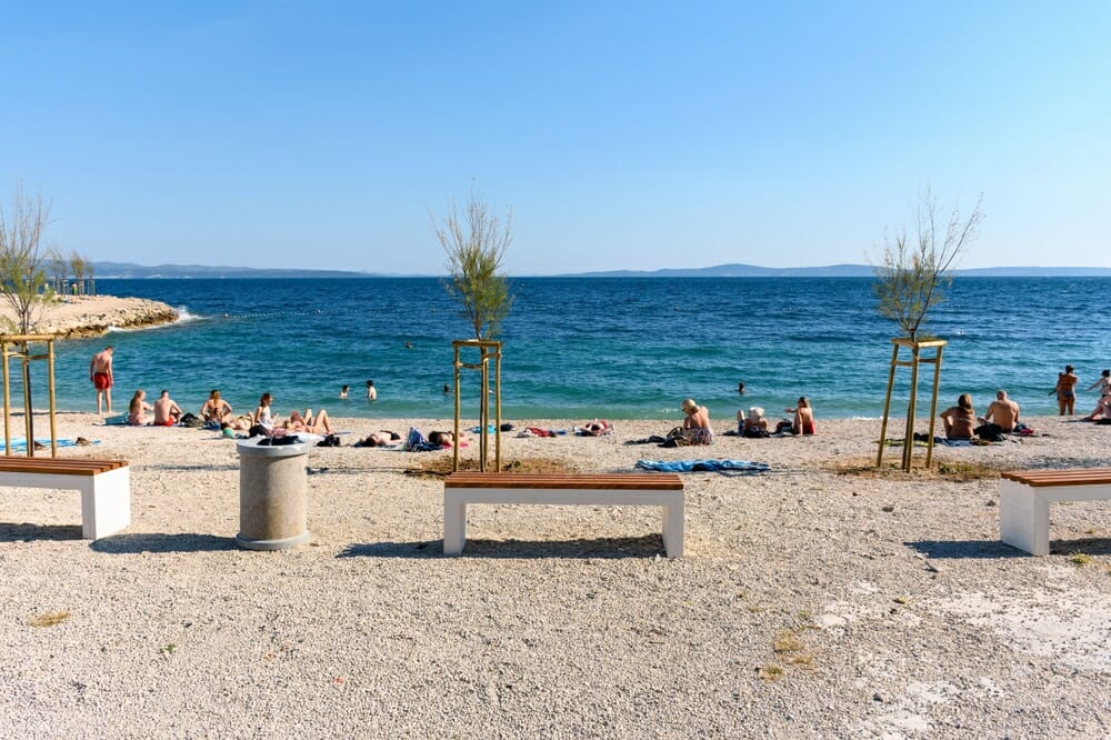 A beautiful view of people sunbathing and swimming on Jezinac beach