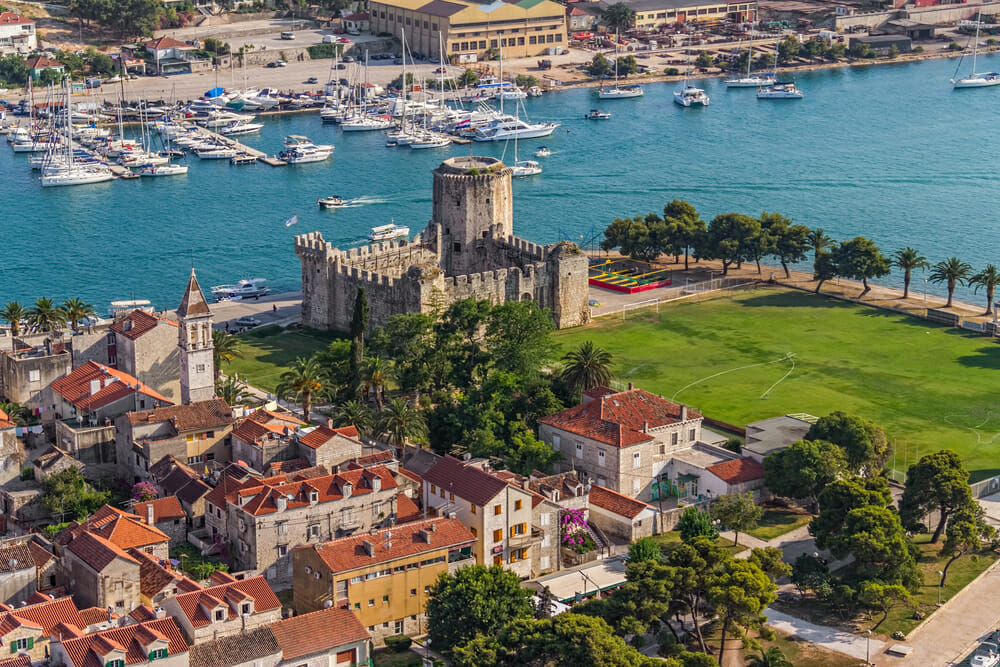 Aerial helicopter shoot of Trogir old town panorama with Kamerlengo Castle