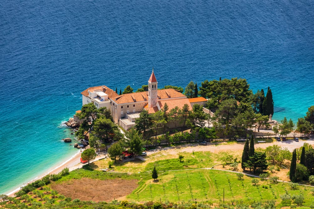 View of beautiful bay with beach and Dominican monastery in Bol town